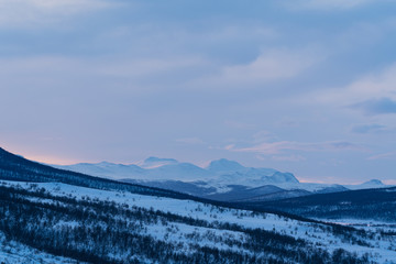 Fototapeta na wymiar Sunrise over the mountains in Dovrefjell National Park