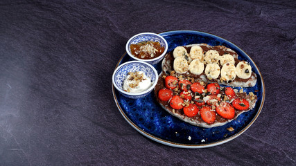 Waffles combined with Turkish delicacies are strawberries, bananas, honey, milk cream.