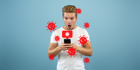 Young man using phone, watching news of coronavirus spreading and worldwide cases, shocked and sad. Flu virus protection, prevention, treatment. Healthcare and medicine. Viruses illustration. Ad.