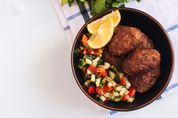 Fried minced meat kofta or kebab in a bowl.