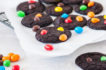 Homemade chocolate brownie cookies with colorful candies.