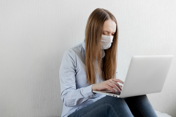 Naklejka premium Coronavirus. Quarantine. Online training education and freelance work. Computer, laptop and girl studying remotely. Coronavirus pandemic in the world. Closing schools