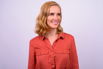 Obraz premium Face of happy beautiful blonde businesswoman thinking