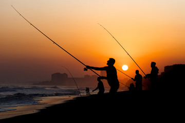 Catching fish at the sunset