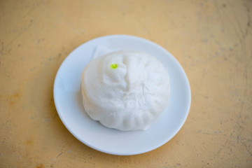 White steamed bun on white dish