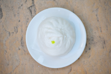 steamed bun on white dish
