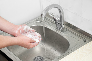 wash your hands with soap and water under the tap