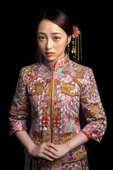 Asian girls wearing ancient clothes on black background