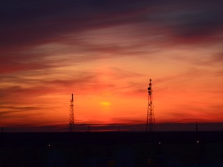  Orange sunset, colorful sky. The clouds. Electric tower.