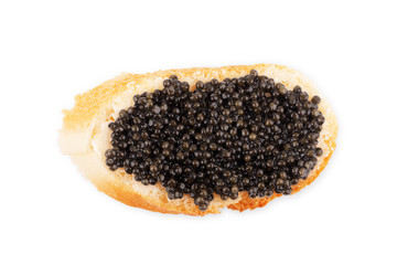 Snack with black caviar isolated on white background