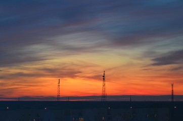  Orange sunset, colorful sky. The clouds. Electric tower.