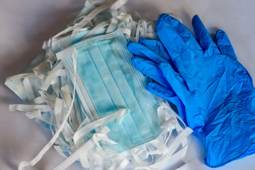 Blue medical protective masks and blue protective gloves.