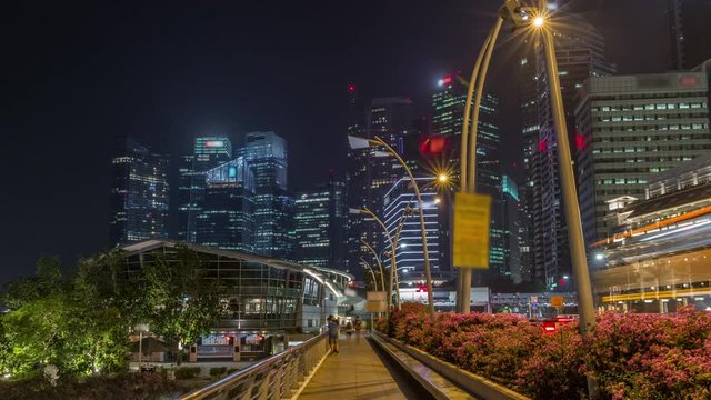 Business Financial Downtown City and Skyscrapers Tower Building at Marina Bay night timelapse hyperlapse, Singapore, Cityscape Urban Landmark and Business Finance District Center from esplanade