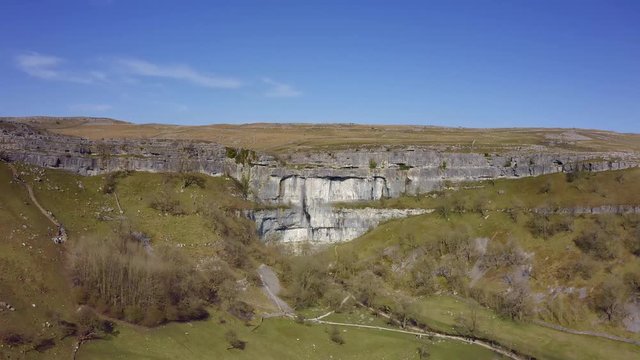 4k drone footage of Malham Cove a limestone landmark in the Yorkshire Dales National Park, UK