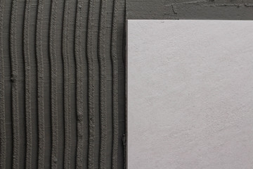 tiles on the wall smeared with tile adhesive