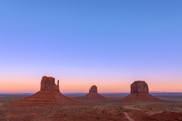 Fototapeta na wymiar Beautiful sunset over famous Buttes of Monument Valley on the border between Arizona and Utah, USA