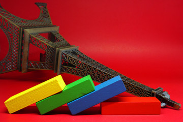 Domino crash fall of eiffel tower france country on red background , The impact of financial status and inflation or from viruses covid-19 - business - Real estate business , Economic problems