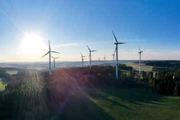 Obraz premium wind wheels in an evening countryscape