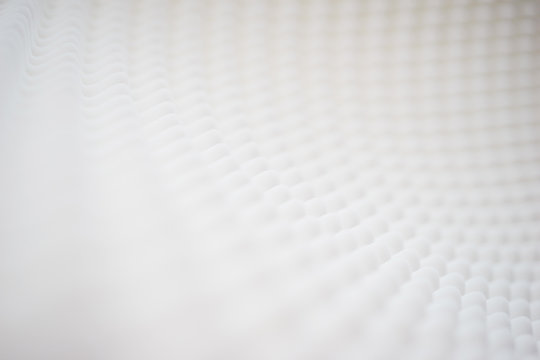 White gradient abstract background with many waves at different angles.