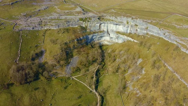 4k drone footage of Malham Cove a limestone landmark in the Yorkshire Dales National Park, UK