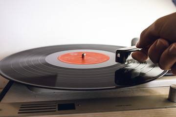 Close up of vinyl record player on a white background. Shallow depth of field, focus select.