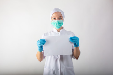 Clipboard with blanc sheet in hands of female doctor