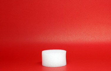 White Spherical plastic or Shockproof foam isolated red background -geometric shapes and decor 