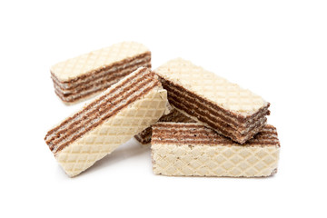 Fototapeta na wymiar Crispy wafers with creamy hazelnut filling isolated on white background