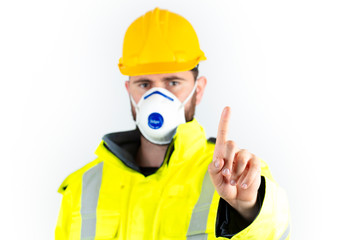 Young engineer in medical mask making stop sign. health and safety concept