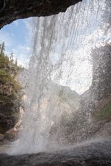 Waterfall in Fanes valley. Alps mountain chain, Cortina d'Ampezzo, Fanes Sennes Braies Nature Park, Dolomites, Italy