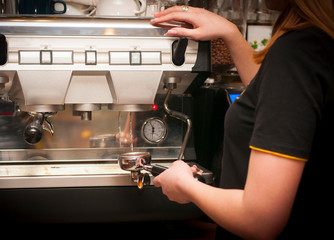 Barista prepares coffee