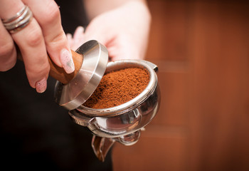 cup of coffee in hands of woman