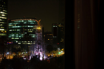 Nightlife in Mexico City with golden rivers of light lighting the streets and buildings