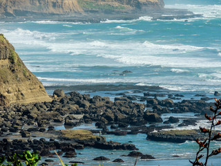 Waves crash ashore on Muriwai Beach, Auckland, New Zealand