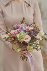 wedding bouquet in hands of bride