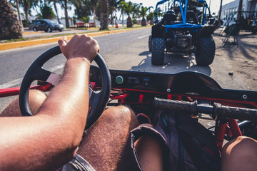 Riding a dune buggy front view