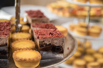 Fruit tartlets dessert and pastry cake sweets on trays