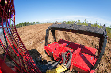Reclamation of an oil production site. Lamtrac mulcher LTR8400 at work. Mulching the swamp.