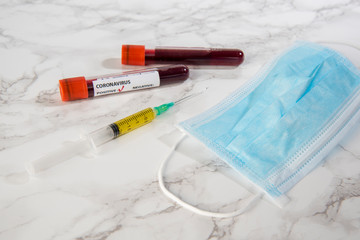 corona virus vaccine with blood sample and protection medical mask 
