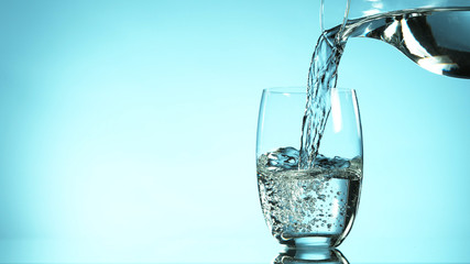 Freeze motion of pouring water from carafe