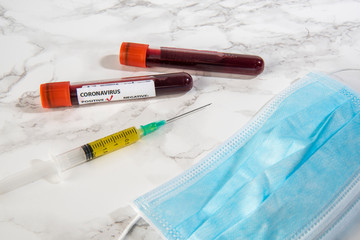 corona virus vaccine with blood sample and protection medical mask 