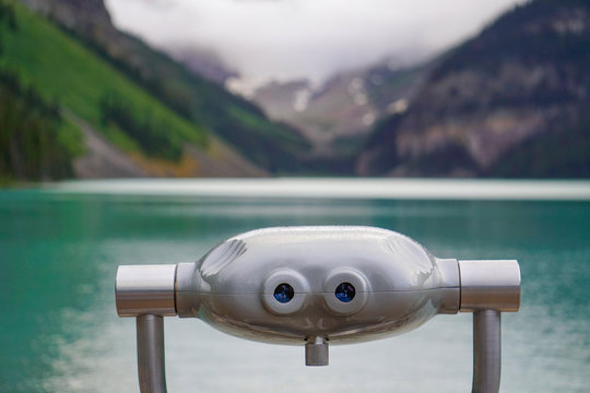 A Tower Viewer Overlooks a Turquoise Lake in the Canadian Rockies - Powered by Adobe