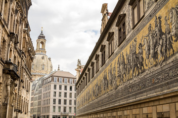 Fototapeta na wymiar Dresden, Saxony / Germany - July 11, 2019: Furstenzug giant mural decorates mosaic on the wall of Augustus Street in Dresden, Germany