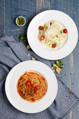 two plates with pasta