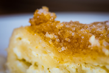 Freshly coocked strukel served with sugar and breadcrumbs broiled on butter.