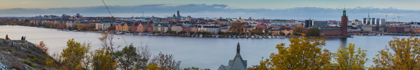 Fototapeta na wymiar Beautiful landscape photo of Stockholm cityscape viewed from Skinnarviksberget on early evening in autumn. Beautiful Stockholm evening panorama from famous vantage point.