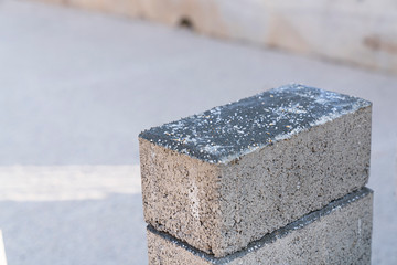 Workers lay paving tiles, construction of brick pavement, close up architecture background stock photo...