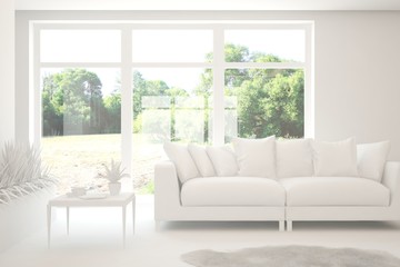 Fototapeta premium White living room with sofa and summer landscape in window. Scandinavian interior design. 3D illustration