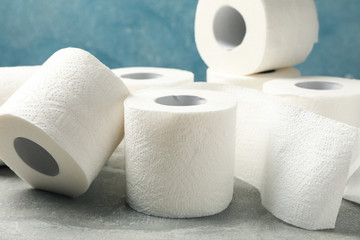 Toilet paper on grey table, close up