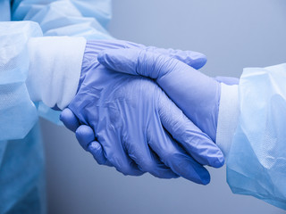 Doctors shake hands